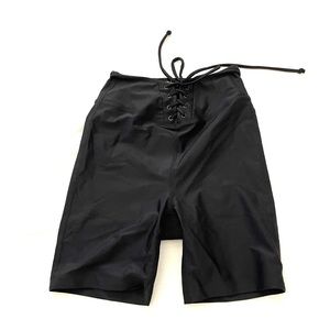 Women’s size XS lace up biker shorts, never worn, perfect condition.